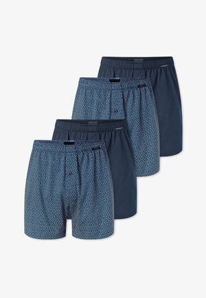 Quatre paires de boxers pour hommes à taille élastique, alternant entre un uni bleu marine et un motif à losanges bleus.