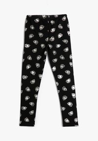 Leggings negras con un patrón repetido de cabezas de león plateadas, hechos de un tejido elástico con una cinturilla elástica para mayor comodidad.