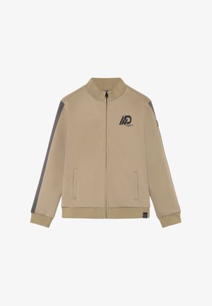 Veste beige à fermeture éclair avec col, poignets et ourlet côtelés, bande grise sur les manches, poches avant, et logo noir sur la poitrine et l'ourlet.