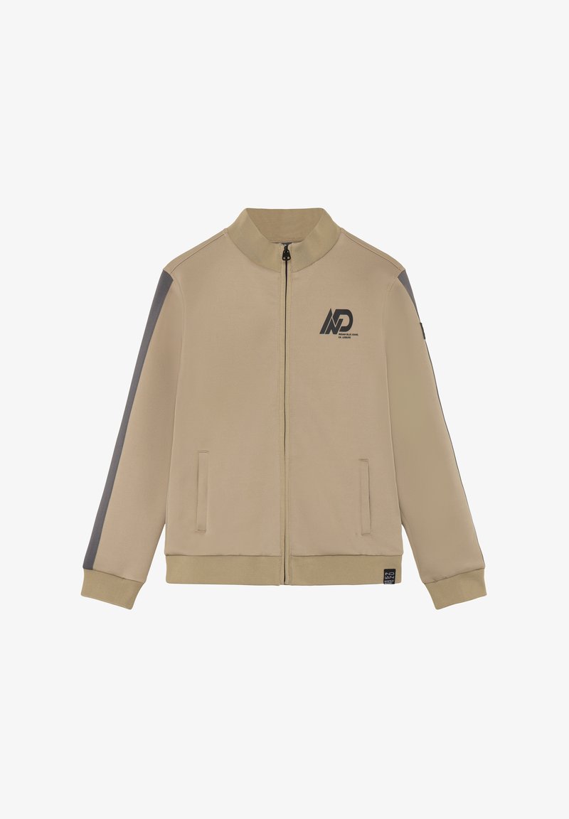Veste beige à fermeture éclair avec col, poignets et ourlet côtelés, bande grise sur les manches, poches avant, et logo noir sur la poitrine et l'ourlet.