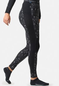Svarta leggings gjorda av texturerat tyg med ett snöflinge- och geometriskt mönster i grått, med en hög midja som har logodetaljer.
