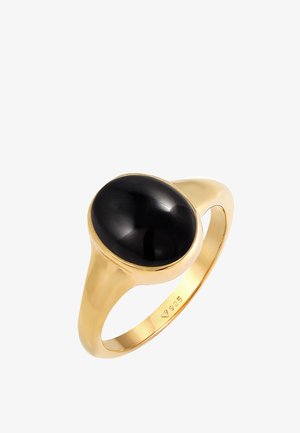 Anello in tonalità oro con una pietra nera ovale liscia montata su una robusta fascia. Contrassegnato "925" per il contenuto di argento sterling.