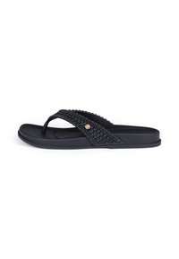Black flip-flop sandals with woven straps and a textured footbed. Features a decorative circular accent on the strap. Flat, lightweight design.