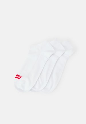 Three pairs of white cotton socks with ribbed cuffs and a red logo on the side. Smooth texture, ankle length design.