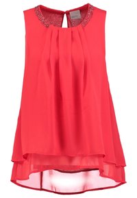 Blusa senza maniche di colore corallo con pieghe, collo alto e colletto decorato. Tessuto morbido e leggero con un orlo posteriore arrotondato e più lungo.