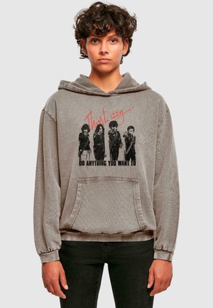 Grå oversized hoodie med lange ærmer, der har et grafisk print af fire figurer og teksten "Thin Lizzy - DO ANYTHING YOU WANT TO."