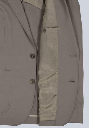 Beige men's blazer with two button closure, patch pocket, and smooth satin inner lining visible on one side.