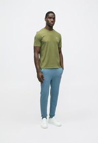 HUGO DOAK - Verryttelyhousut - open blue