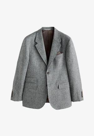 Blazer en laine grise avec une finition texturée, cols crantés, deux poches avant et une poche poitrine avec un accent marron. Fermeture à deux boutons.