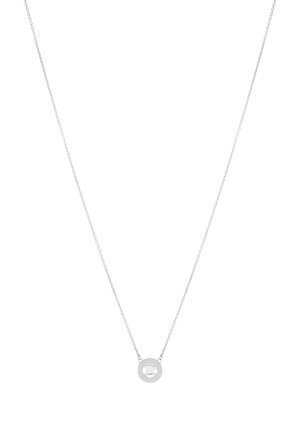 Silver necklace with a fine chain and a circular pendant featuring a central clear stone. Minimalist design and smooth texture.