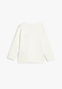 Witte, lange mouwen sweatshirt van ribstof. Kenmerkt zich door een ronde halslijn, raglanmouwen en een gestikte zoom met zijslits.