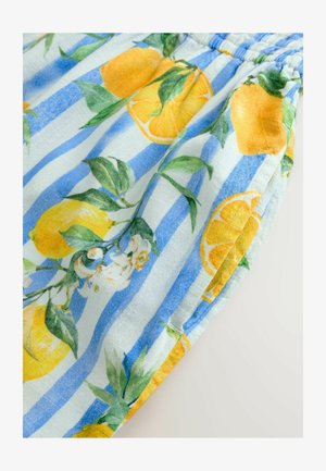 Tissu rayé bleu et blanc avec des citrons jaunes et des feuilles vertes. Le matériau semble léger et texturé avec des accents floraux.