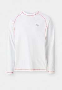 White long-sleeve t-shirt with red stitching accents and a small black “OBEY” logo on the chest. Cotton material, crew neck design.