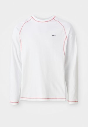 White long-sleeve t-shirt with red stitching accents and a small black “OBEY” logo on the chest. Cotton material, crew neck design.