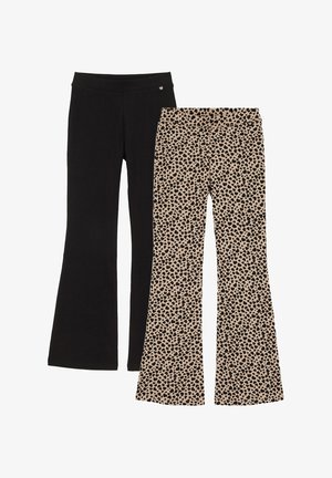 Zwei Paare ausgestellter Hosen: eines in einfarbigem Schwarz, das andere beige mit schwarzen, herzförmigen Flecken, beide mit elastischen Bund.