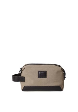 Tan canvas toiletry bag with dark brown leather accents, rectangular shape, top zipper closure, and side handle for easy carrying.