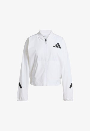 Giacca bianca corta realizzata in materiale sintetico, con zip frontale, due tasche e inserti diagonali neri su maniche e petto.