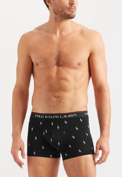 Boxeri negri, cu elastic cu logo, având desenate repetitiv mici jucători de polo albi, realizati dintr-un material neted și elastic.