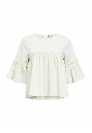 Top beige chiaro con maniche corte a campana e una cucitura con volant sul petto. Realizzato in un tessuto morbido, presenta una chiusura a chiave sul retro.