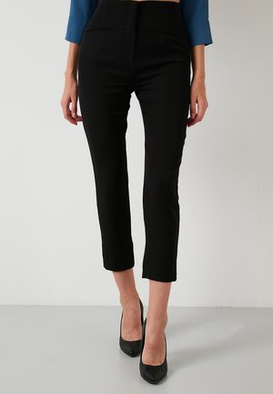 SLIM FIT - Trousers - black
