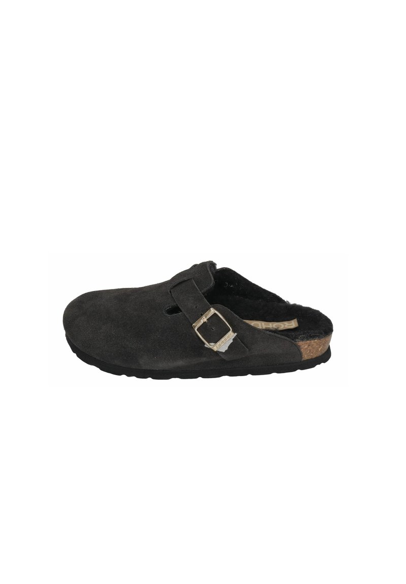 Clogs made of black suede with a cork footbed. Features a single adjustable strap with a silver buckle. Soft, textured interior.
