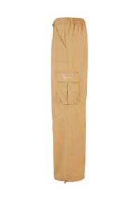 Beige cargobyxor med elastisk midja, sidfickor och justerbara muddar. Tillverkade av lätt material, med en ficka på låret.