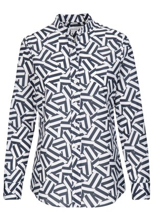 Long-sleeve button-up shirt with a black and white geometric zigzag pattern and a stand-up collar.