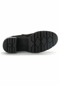 Black Gabor shoe sole with a textured rubber finish, featuring a geometric tread pattern for grip and a smooth, contoured design.