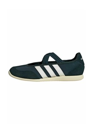 Black Adidas flat shoe with white sole, Mary Jane style strap, and white three-stripe logo on the side.