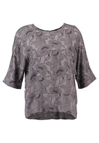 Blusa corta a maniche corte di colore viola chiaro con motivo floreale nero, scollo tondo e vestibilità ampia con orlo curvo.