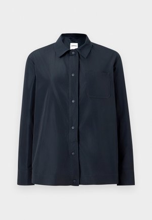 Black long-sleeve shirt with front snap buttons, a single chest pocket, and a pointed collar, displayed on a plain light background.