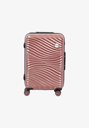 Hard-shell rose gold suitcase with textured wave patterns, four spinner wheels, and a circular logo near the top right corner.