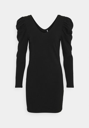 Schwarzes, figurbetontes Langarmkleid mit tiefem V-Ausschnitt und betonten Schultern, knielang, einfarbiger Stoff vor weißem Hintergrund.