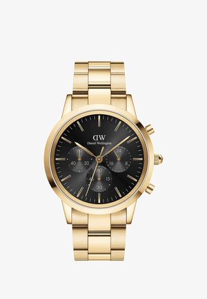 Gouden metalen horloge met een zwarte wijzerplaat, drie subdials en gouden uurmarkeringen. Beschikt over een roestvrijstalen band met geborstelde en gepolijste secties.