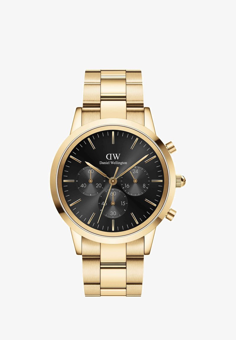 Gouden metalen horloge met een zwarte wijzerplaat, drie subdials en gouden uurmarkeringen. Beschikt over een roestvrijstalen band met geborstelde en gepolijste secties.