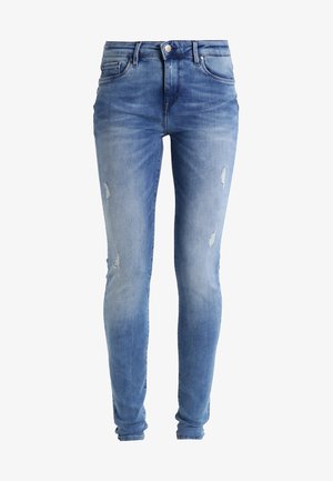 Lys blå denim skinny jeans med mid-rise midje og lett slitasje på knærne. Glatt tekstur med en tettsittende silhuett.