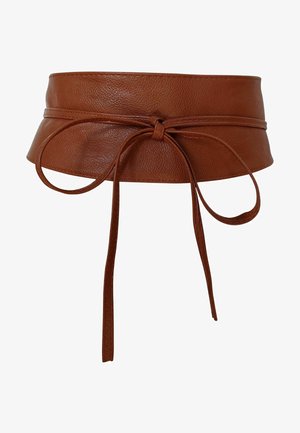 Ceinture large en cuir marron avec un nœud à l'avant et de longues lanières fines qui pendent, conçue pour s'enrouler autour de la taille.