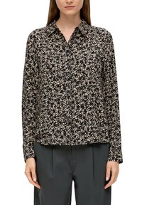 Zwarte en crèmekleurige blouse met bloemenpatroon, met een knoopsluiting aan de voorkant, kraag en lange mouwen. Zachte stof met een relaxte pasvorm.