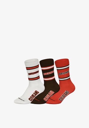 Three pairs of crew socks in white, brown, and orange. Each features horizontal stripes, ribbed cuffs, and "BROWNS" text in bold.