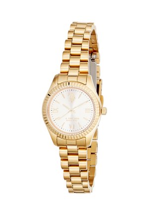 Montre-bracelet ton or avec un cadran blanc, des chiffres romains, trois aiguilles et un bracelet à maillons métalliques.