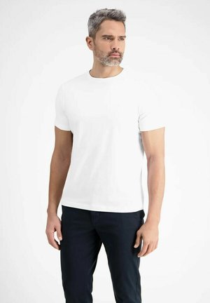 White short-sleeve t-shirt in a classic crew neck design, made of soft cotton fabric, paired with dark pants, standing model.