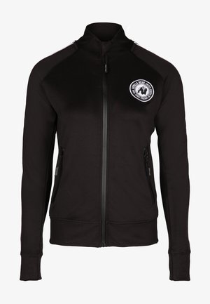 Zwarte zip-up jack met een hoge kraag, voorzien van twee zijzakken met rits en een rond logo op de linkerborst. Gladde stofstructuur.