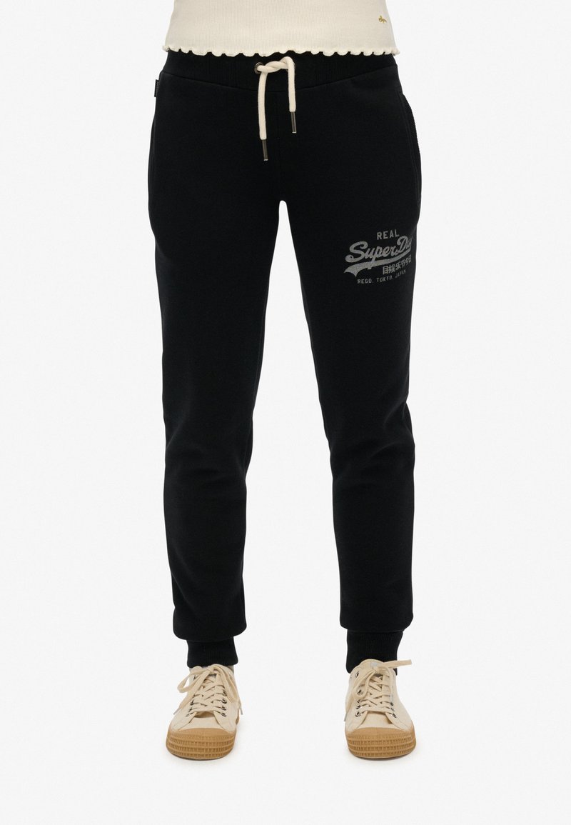 Schwarze Sweatpants mit einem Kordelzugbund, featuring ein strukturierten Logodruck, bündchen an den Knöcheln und einer weichen Stofftextur.