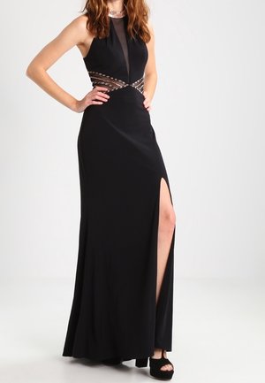 Zwarte avondjurk met een doorschijnend bovenstuk, versierde taille en hoge split. Gladde stof met een aansluitende pasvorm en een lange rok.