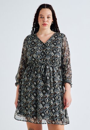 Black patterned dress with sheer long sleeves, v-neckline, elastic waist, and a flowy skirt featuring floral and geometric designs.