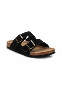 Sandali in suede nero con due cinturini regolabili, fibbie in bronzo e una soletta in sughero. Presentano una suola nera texturizzata per una buona aderenza.