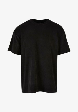 Crna pamučna majica s kratkim rukavima, okruglim izrezom, opuštenog kroja i glatke teksture. Nema uzoraka ili dodatnih detalja.