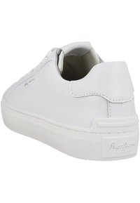 White leather sneaker with a smooth texture, low profile, round toe, and minimalistic design. Features branded heel tab and rubber sole.