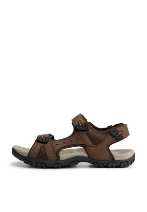 Brown outdoor sandal featuring a leather upper with mesh panels, adjustable straps, and a cushioned footbed on a black rubber sole.