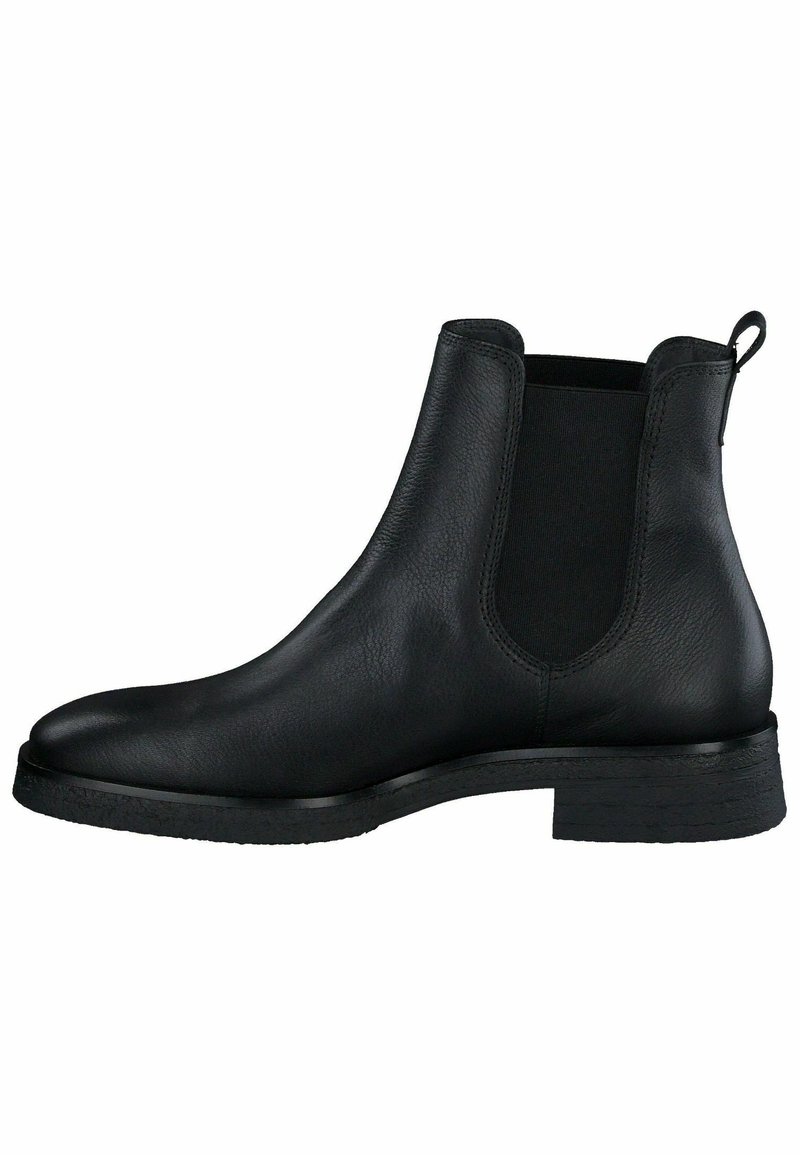Bottine Chelsea en cuir noir, présentant une texture lisse, des panneaux latéraux élastiques et une languette à l'arrière ; semelle en caoutchouc plate.